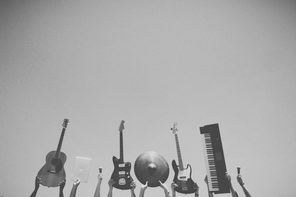 Band Holding Up Instruments Outside